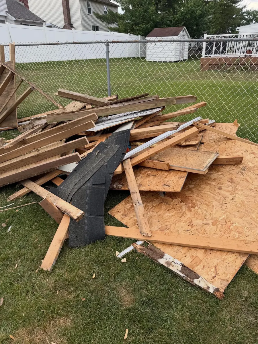 Construction debris staged for haul-away by Hero's
