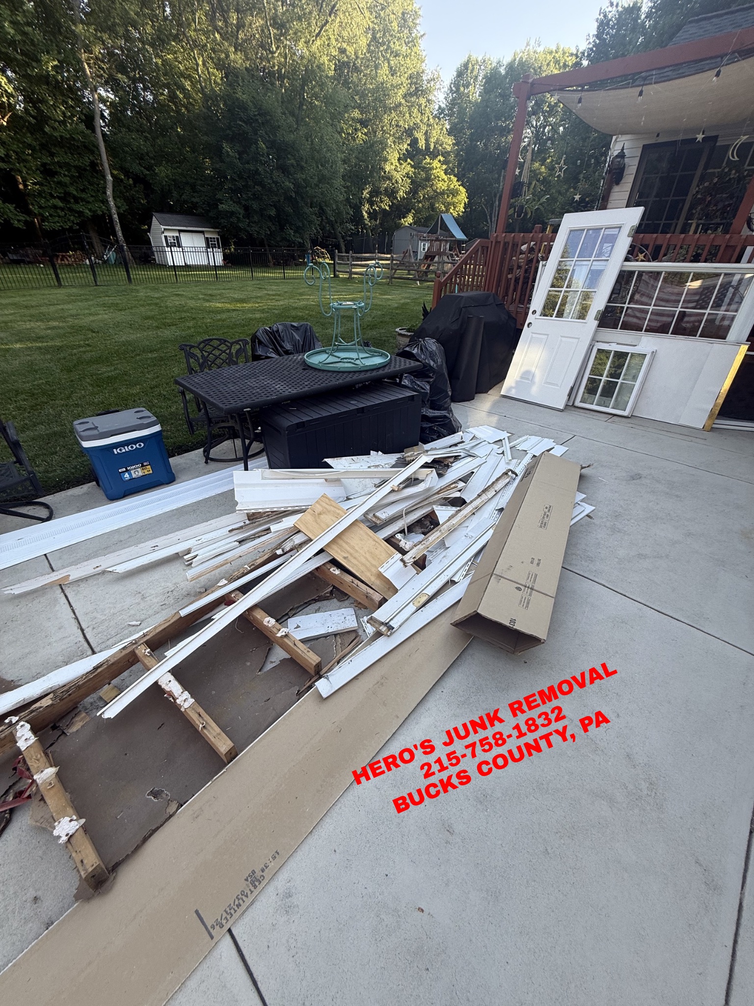 Loaded truck on a commercial junk-removal job by Hero's
